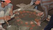 4 Biogas Digester Facts Everyone Can Benefit From Image shows workmen building a fixed dome biogas digester.